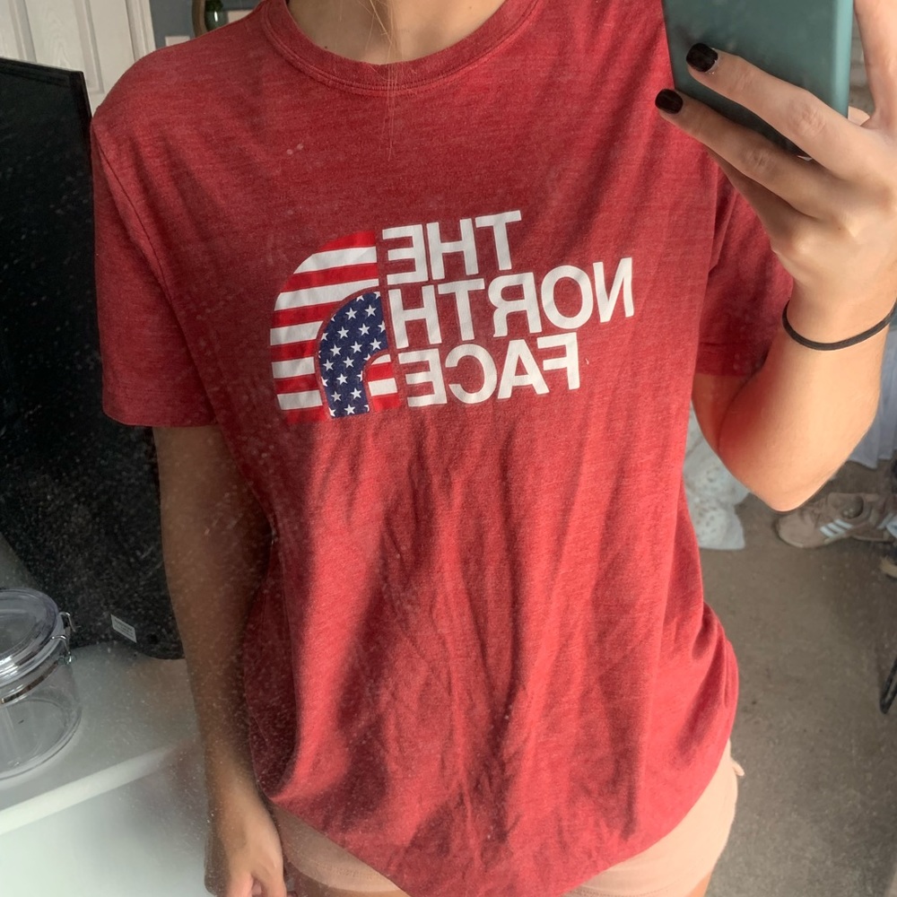 Red The North Face T-Shirt, size adult medium.